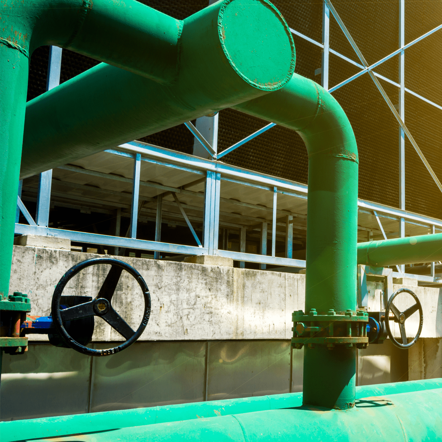 Wide diameter pipes and heavy-duty valves, forming part of an industrial-scale cooling system at a large data centre