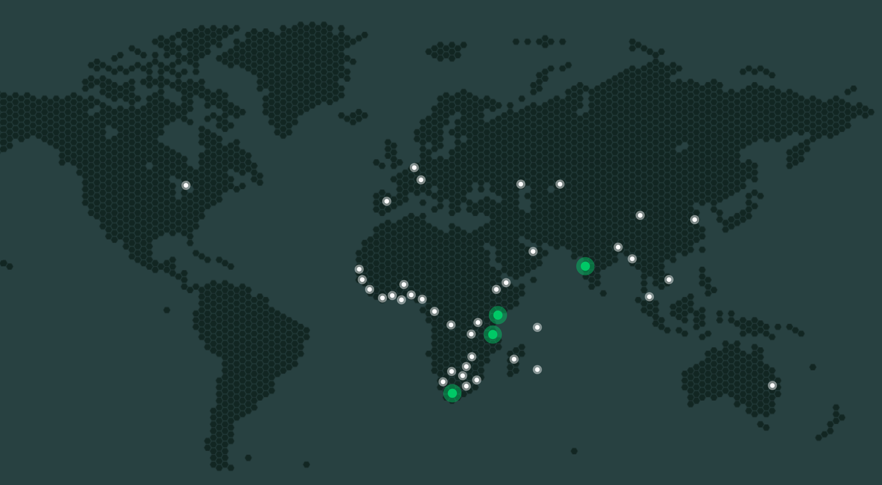Darkened world map with large green dots showing where Greenleaf teams are located and smaller white dots showing the locations of sister company offices that Greenleaf operates out of worldwide